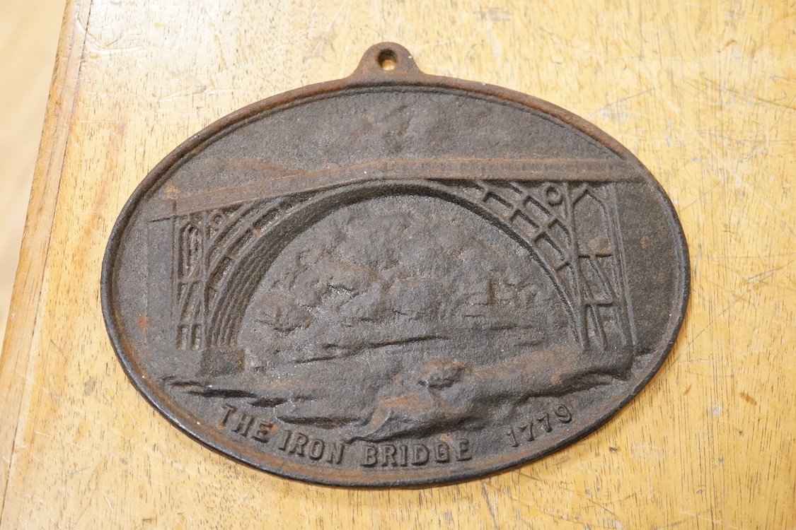 A reproduction Salop cast iron ‘The Iron Bridge 1779’ plaque together with a lead fire-mark, Salop Fire Office, latter 19cm high
